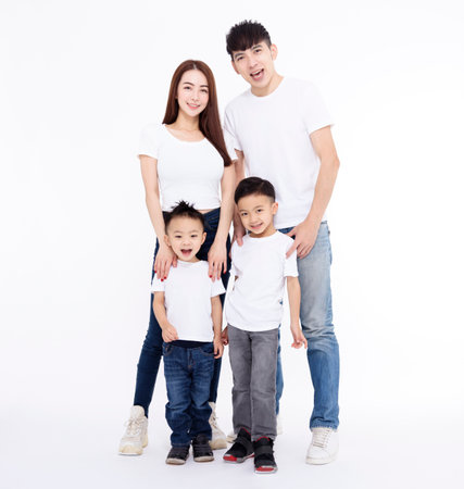 Happy Asian family standing together on white backgroundの写真素材