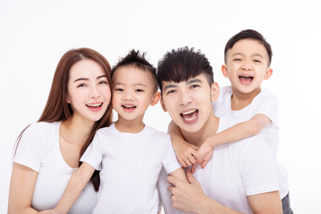 Happy Asian family isolated on white backgroundの写真素材
