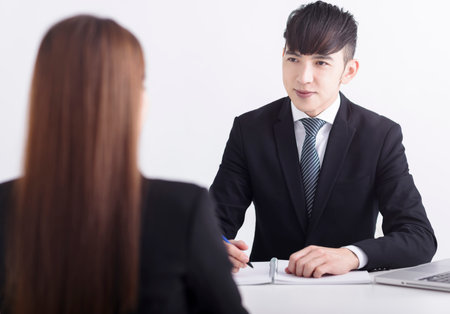 Business manager interviewing young women job applicant in the officeの写真素材