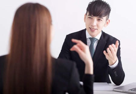 Business manager interviewing young women job applicant in the officeの写真素材
