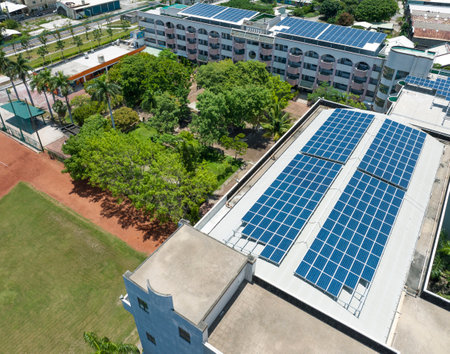 Aerial view many solar panels on the roof of school