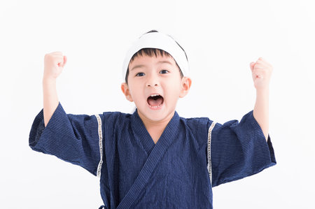 Excited Asian Kid wearing kimono japanese clothesの写真素材