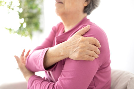 Senior woman shoulder pain osteochondrosisの写真素材