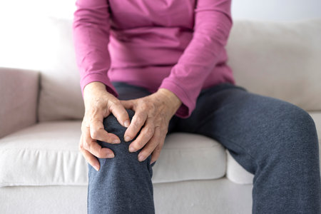 senior woman suffering from knee acheの写真素材
