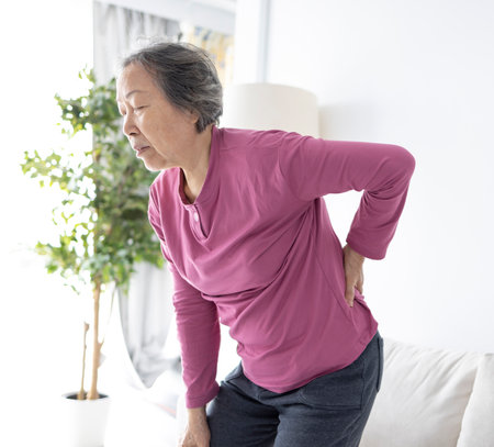 senior woman with pain in backの写真素材