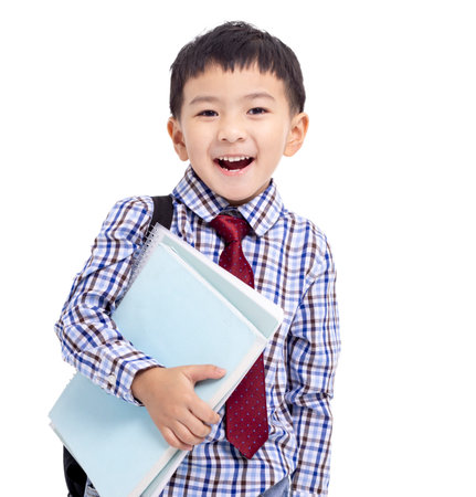 Back to school. Schoolboy student holding with booksの写真素材