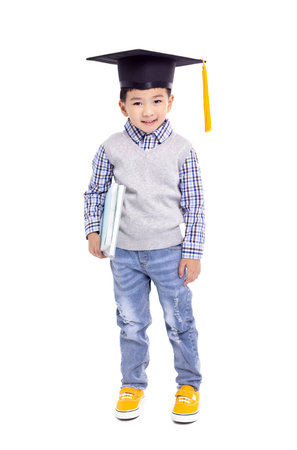 Happy Asian school kid graduate in graduation capの写真素材
