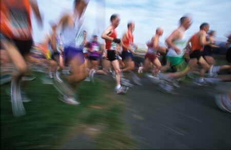 Field of runners in the April 2002 London Marathon with motion blur and copyspace on the ground