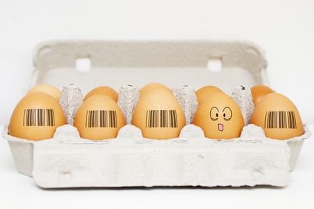 Different from beggining. Al eggsl have same barcodes except one which is showing tongue and smiling.の写真素材
