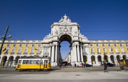 LISBON, PORTUGAL - JAN 5:Stone arch at Terreiro do paco, Commerce square and famous yellow tram in Lisbon on January 5, 2012.のeditorial素材
