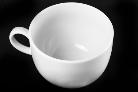 White cup isolated on black backgroundの写真素材