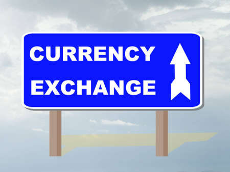 roadsign showing direction to currency exchangeの写真素材
