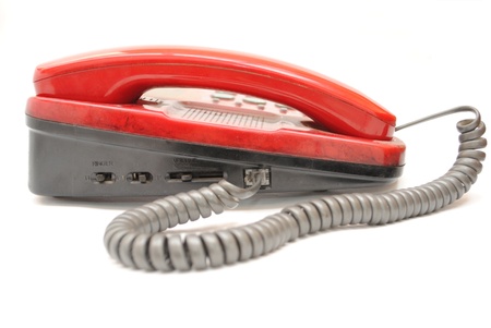 An red telephone isolated white  This phone used in office の写真素材