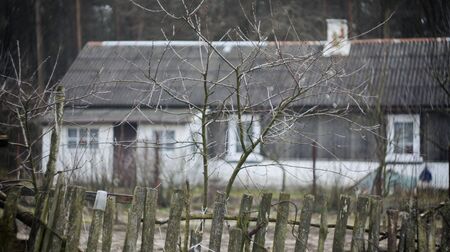 Old house behind a wooden fenceのeditorial素材