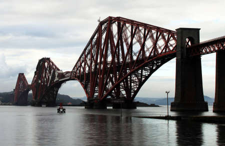Photo of a red railway bridge. Taken somewhere in Scotland, United Kingdom.の写真素材