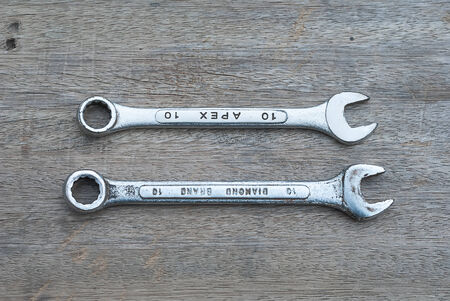 Tools for repair on a wooden background