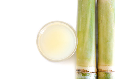 Piece of sugarcane juice in a glassの写真素材