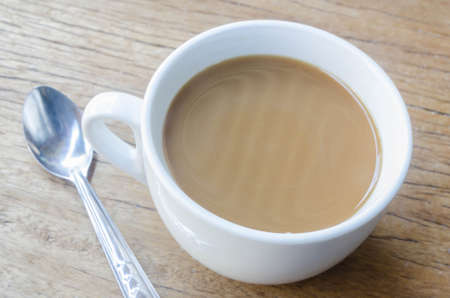 Cup of coffee on a wooden table.の写真素材