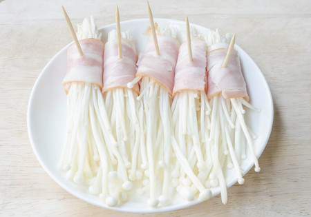 Japanese cooking, prepared enoki mushroom roll.の写真素材