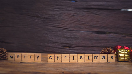 Merry Christmas. Christmas greeting card with rustic wood and ornaments.