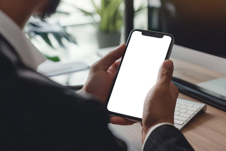 Businessman using mobile phone with a blank screen. modern communication technologyの素材