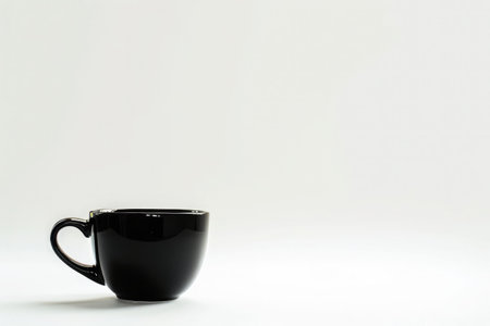 A simple, elegant coffee cup filled with black coffee, against a blank background, emphasizing minimalism and serenityの素材
