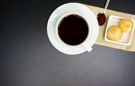 Black coffee in a white pitcher on a black background for a background imageの写真素材