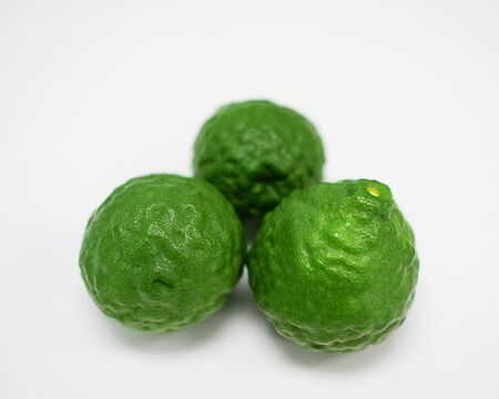 Bergamot, green fruit arranged on a white backgroundの写真素材