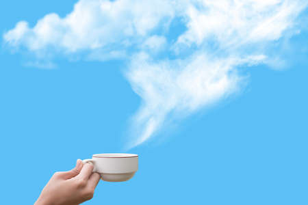 Hand show coffee cup on blue sky の写真素材