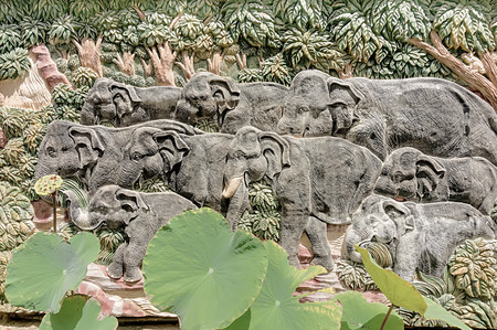 The stucco walls of elephant family の写真素材