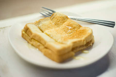 Soft focus Thai Baked Toast with milk and sugarの写真素材
