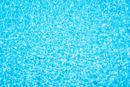 Blue ripped water in swimming poolの写真素材