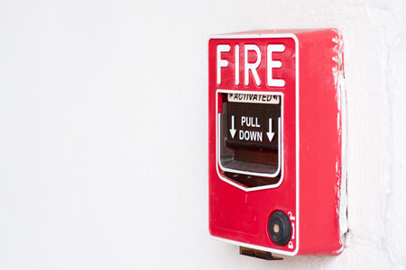 Fire alarm switch on factory wall