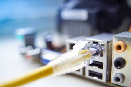 Closeup cable wire network connected to computer.の写真素材