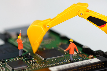 Miniature workers repair harddisk driveの写真素材