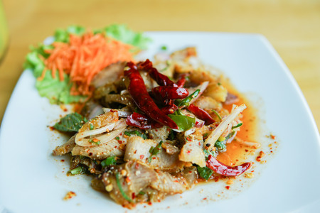 Grilled pork salad on the wood tableの写真素材