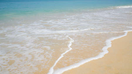 Beach and sand with water wave. Sea foam. Sea wave. Nature background.