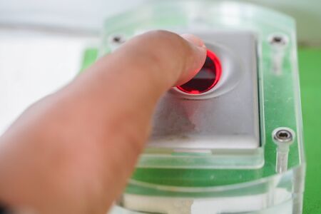 Finger touches on the fingerprint scanner for to record working time.