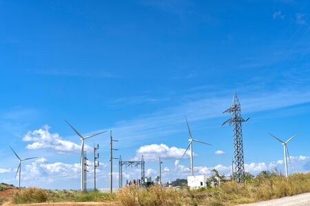 Wind turbines generating electricity with blue sky,renewable energy source.の写真素材