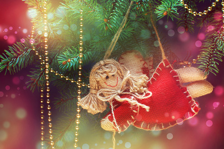 Christmas angel decoration on a pine treeの写真素材