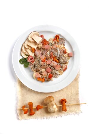 Mushroom salad with white mushrooms, honey agaric, bacon, served with parmesan cheese on white plate. close up.の写真素材