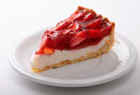 delicate strawberry cheesecake on a white plate. close upの写真素材