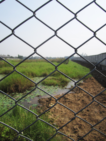 iron net fence on backdrop backgroundの写真素材
