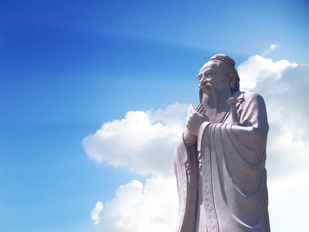 Confucius statue with sky backgroundの写真素材