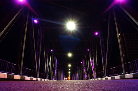 Iron bridge at night in chiangmai ,thailandの写真素材