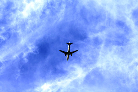 Airplane taking off at sunset
