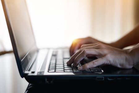 Woman using finger press the keyboard on laptop for working. Concept of Work at home.の写真素材