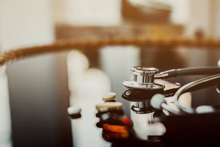Stethoscope with medicine on table, Medicine and health care concept.の写真素材