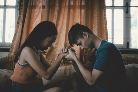 Couples while praying worship for the christian religion in the room, Christian Religion concept.の写真素材