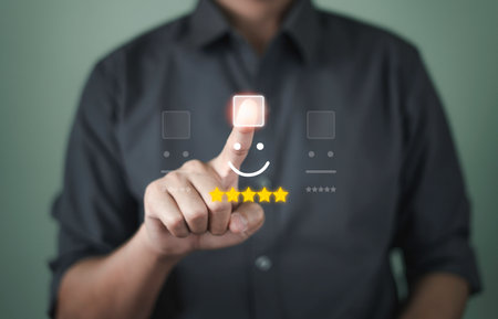 Customer service and Satisfaction concept, Businessmen touch the virtual screen on the happy Smiling face icon to give satisfaction in service. rating very impressedの写真素材